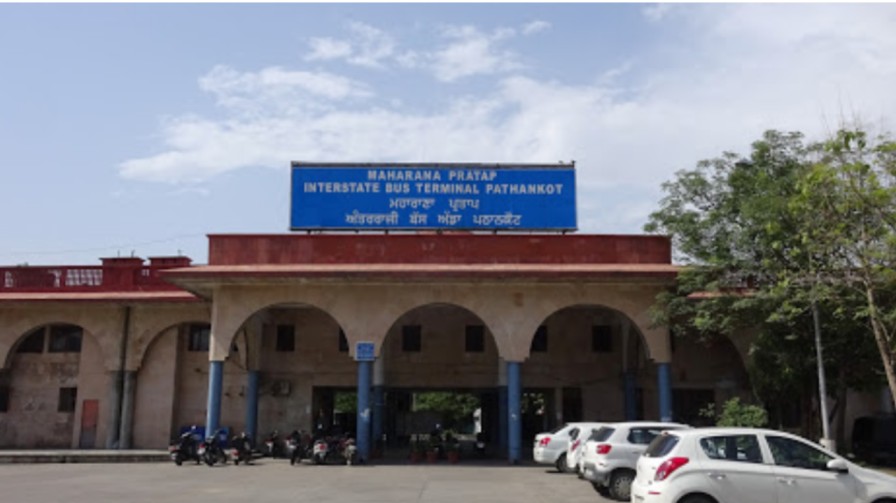 Front View of Pathankot bus stand with name signage in blue color.